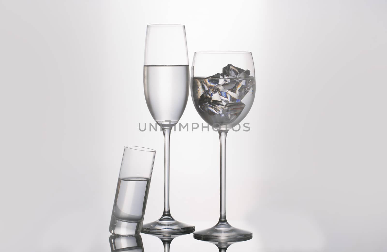 Isolated glass  and cup of water