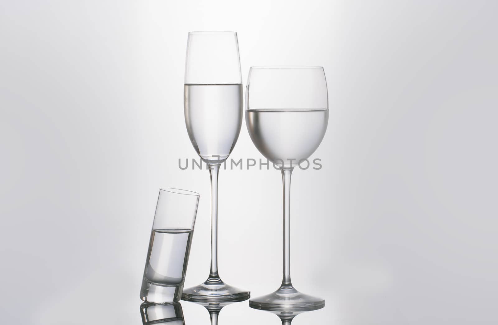 Isolated glass  and cup of water