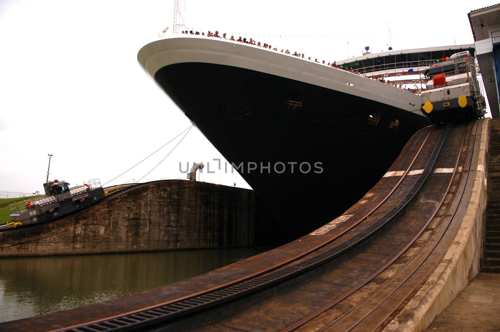 Cruise ship passing trough Panama canal on cloudy day