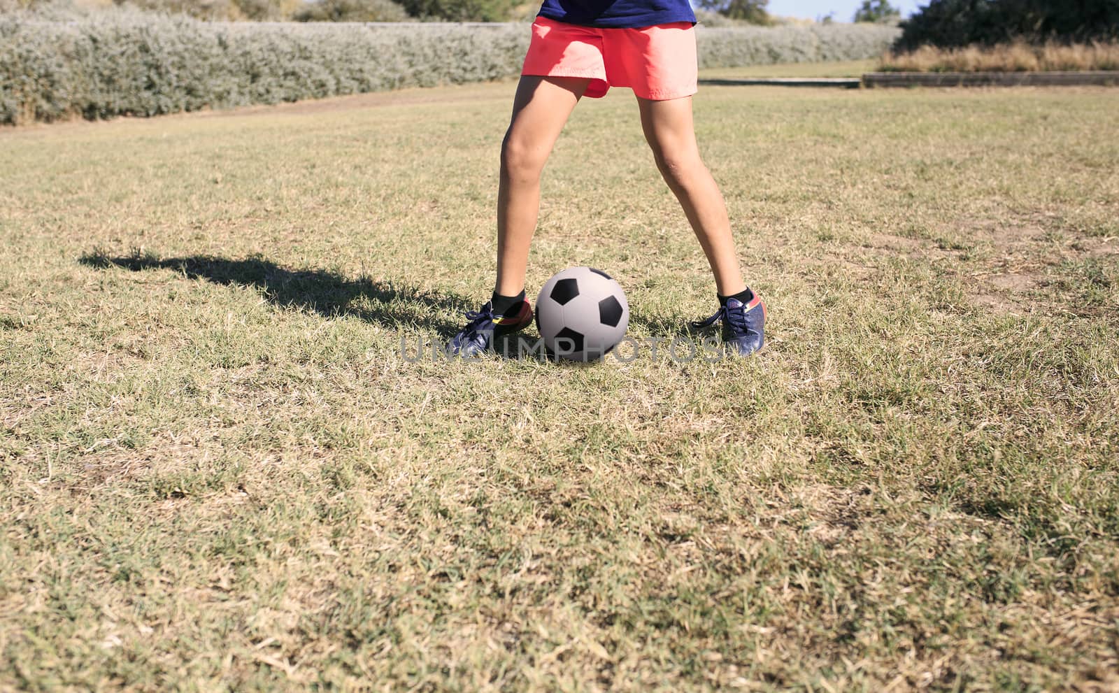 Boy playing football in the park