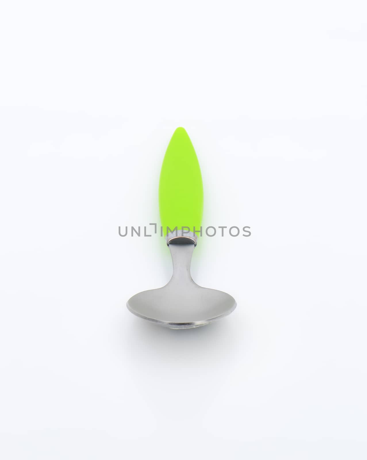 Empty teaspoon with green plastic handle on white background