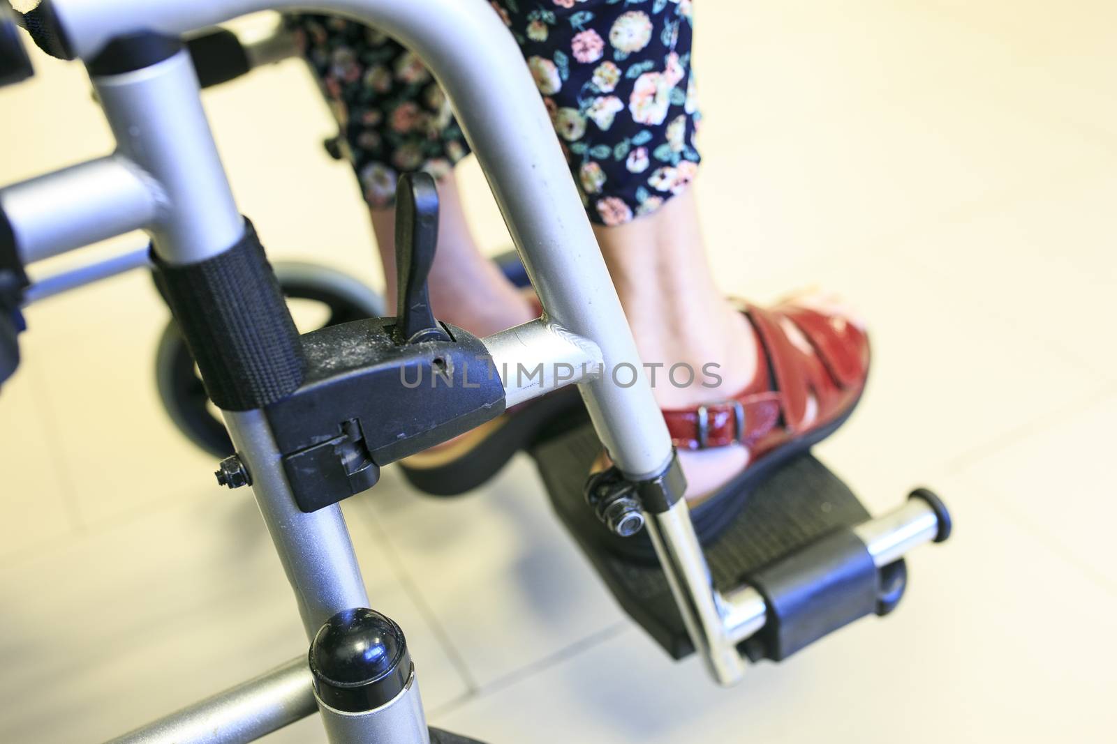  old woman waiting in the hospital in her wheelchair