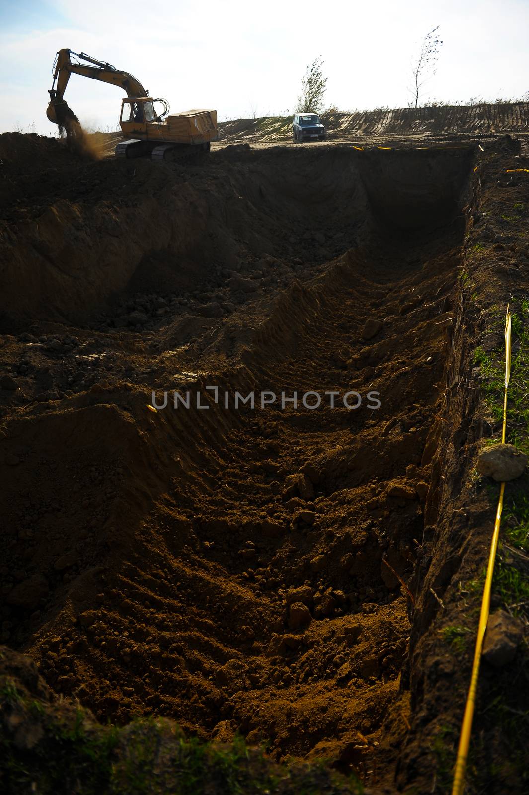 Big excavator in action on construction site