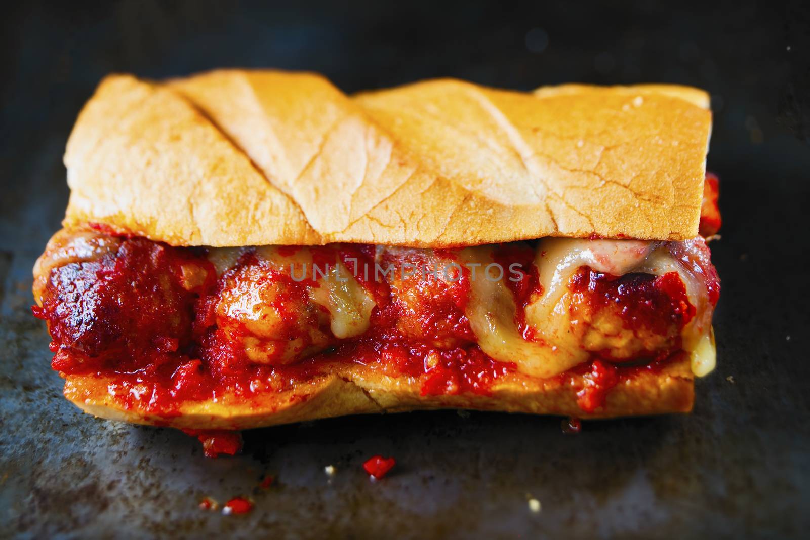 close up of rustic american italian meatball sandwich