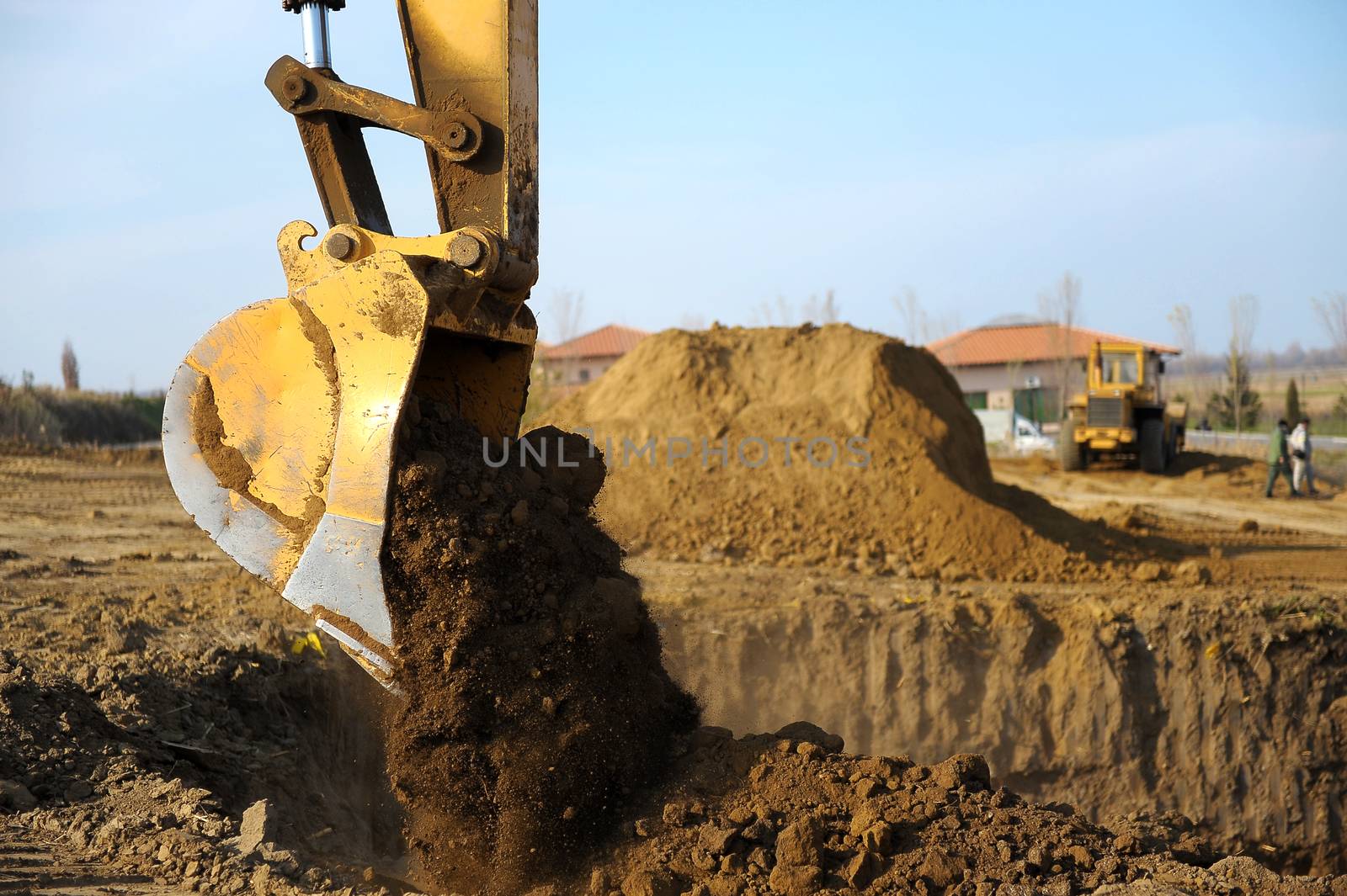 Big excavator in action on construction site