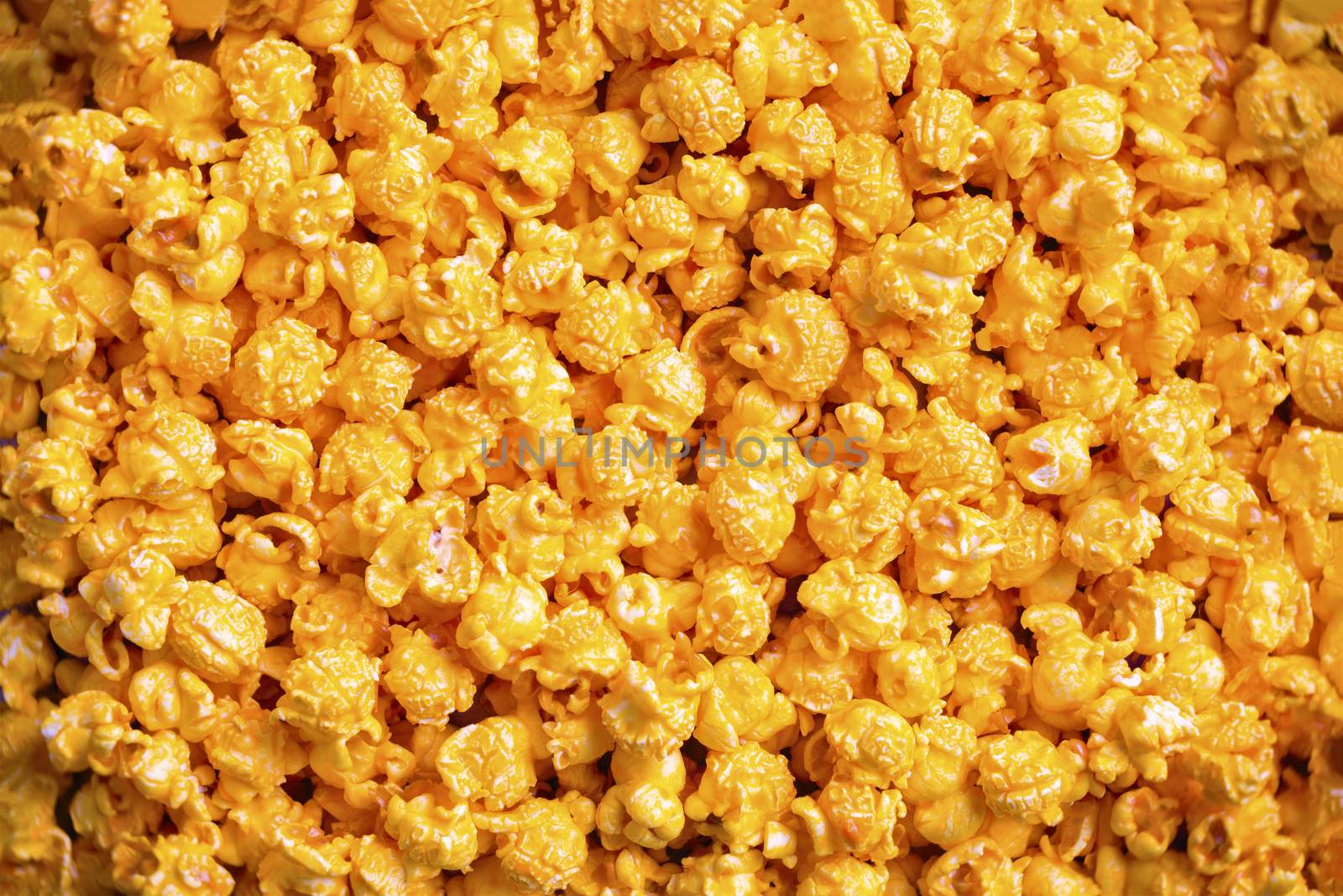 close up of golden cheese popcorn food background