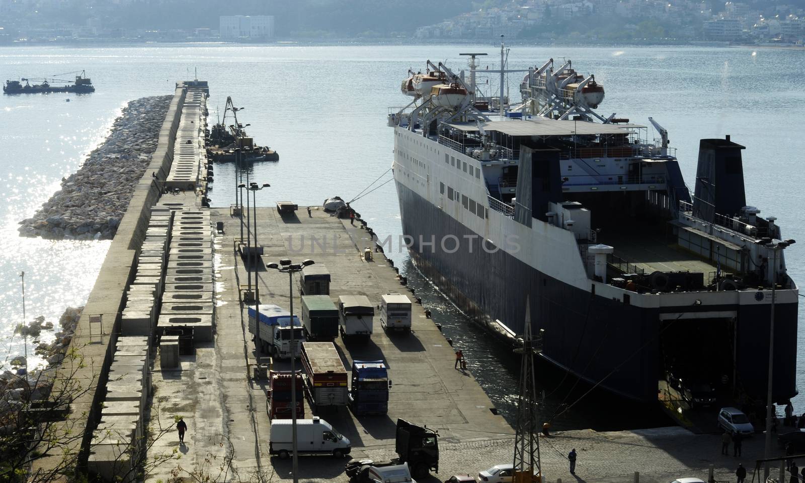 Ferry boat in port embarking passengers on a sunny day
