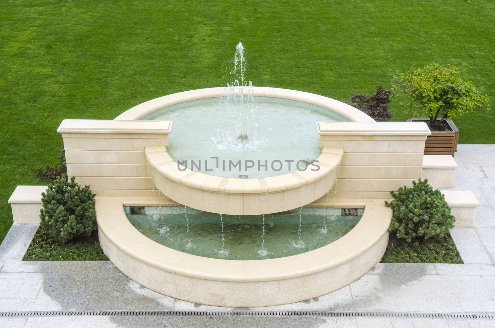 Beautiful fountain splashing water on a sunny day