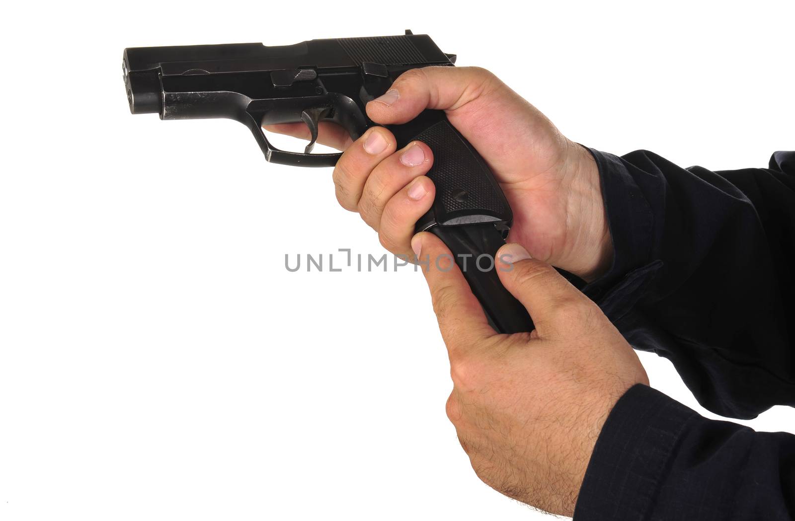 Close up view on gun in the hand on white background