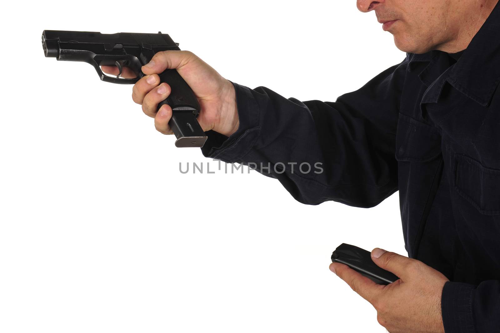 Close up view on gun in the hand on white background