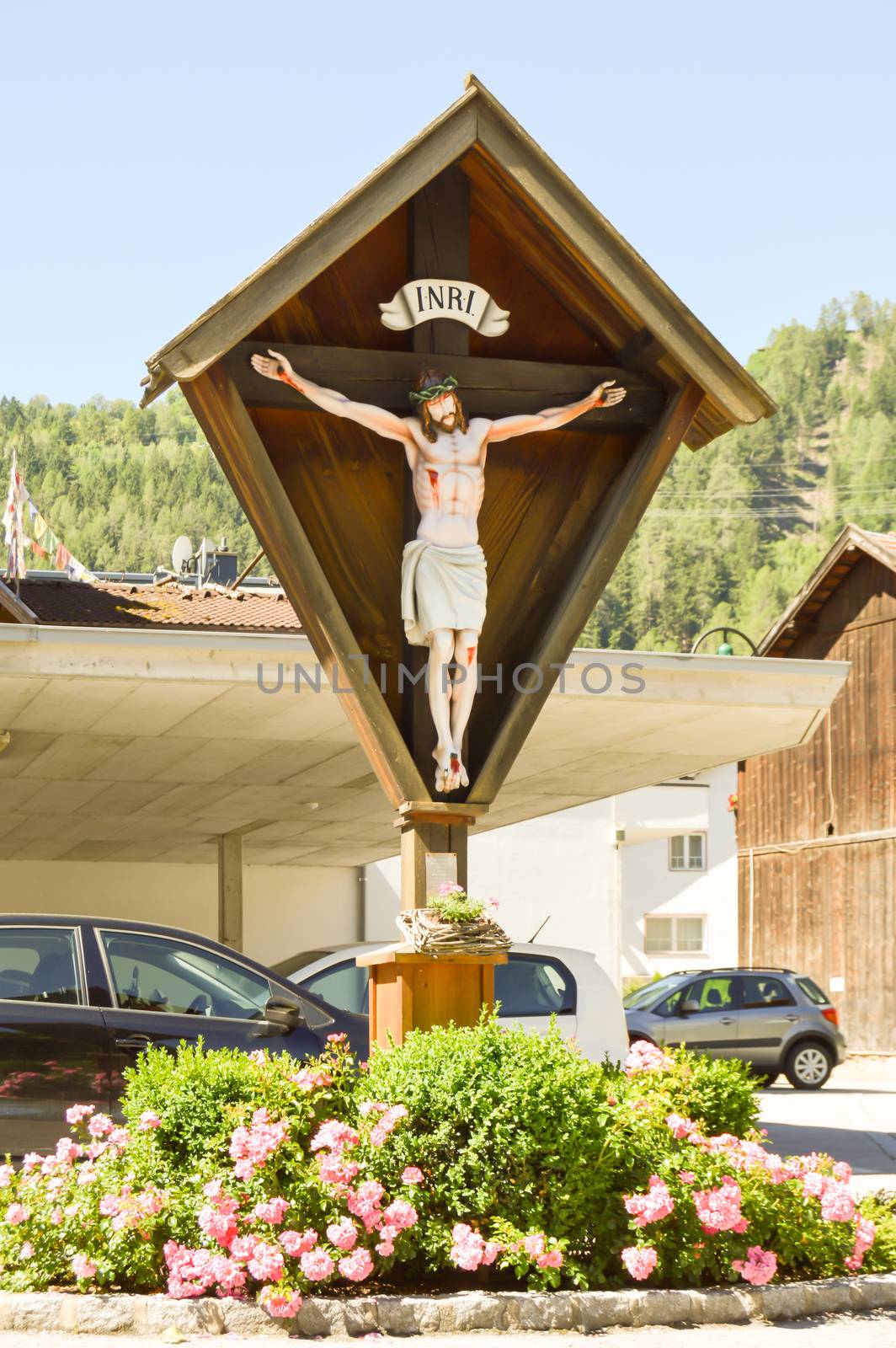 Crucifix over a flowerbed  by Philou1000