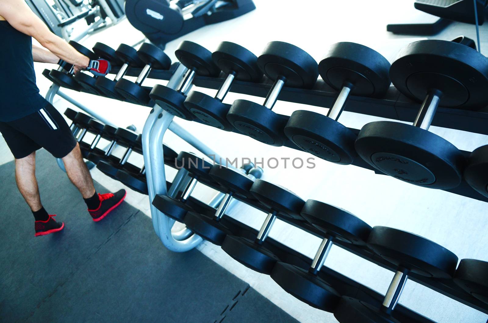 View on modern empty large gym with lot of weights