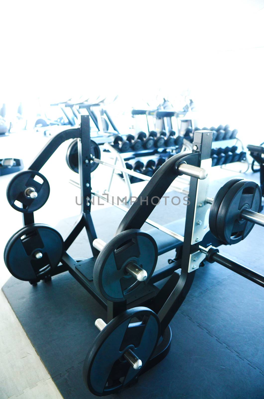 View on modern empty large gym with lot of weights