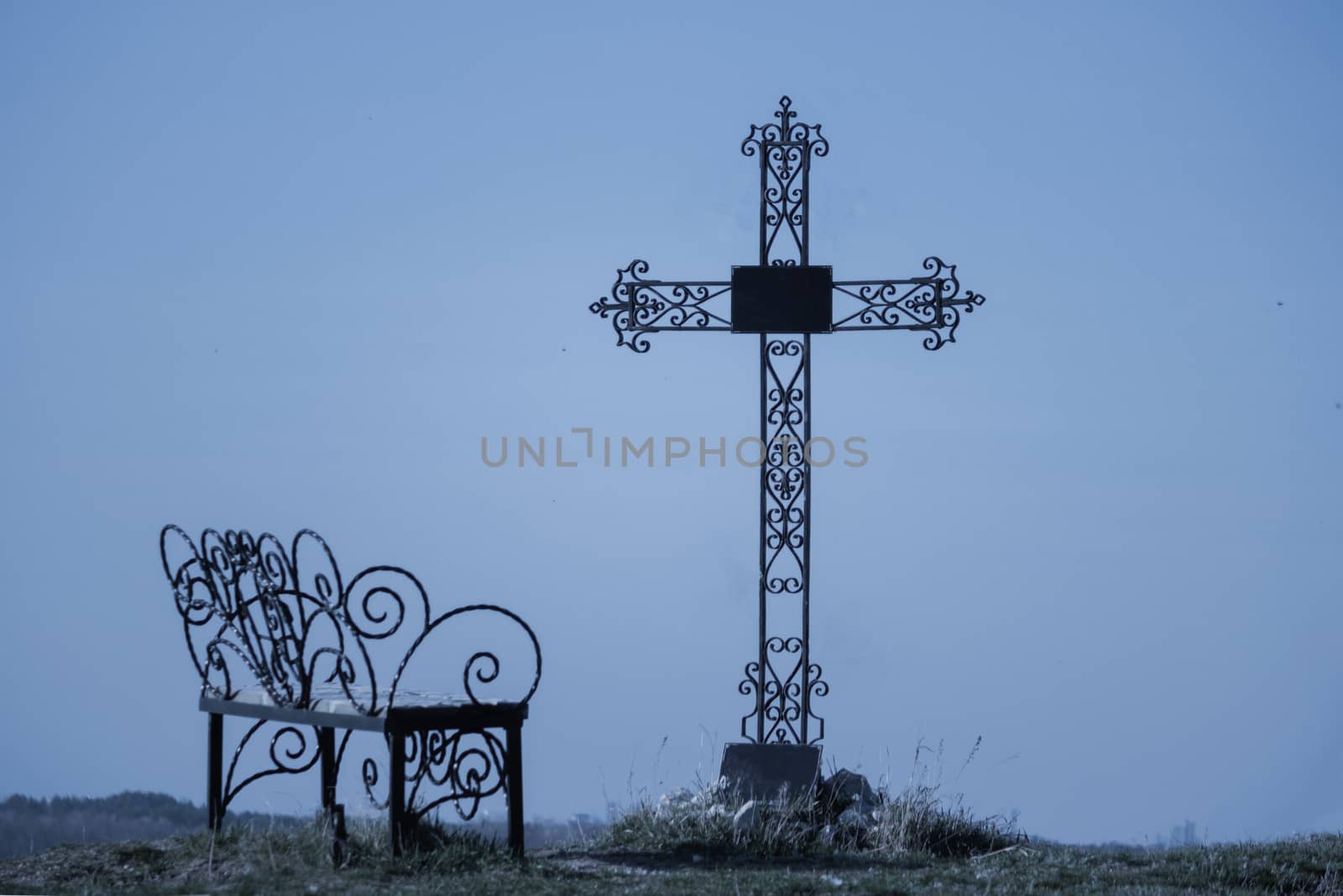 Graveyard cross in silhouette by liwei12