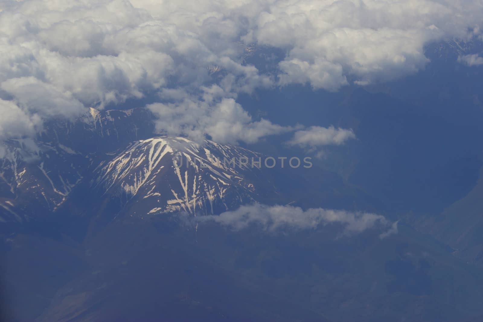 mountains with snow on top. aerial view from plain. Iran