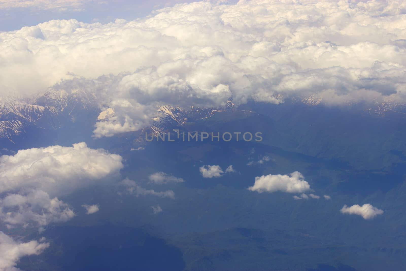 white clouds below. aerial view from a plane