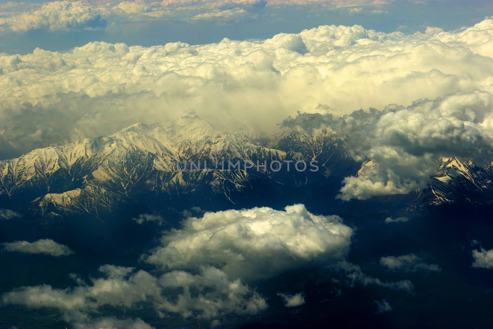 white clouds below. aerial view from a plane