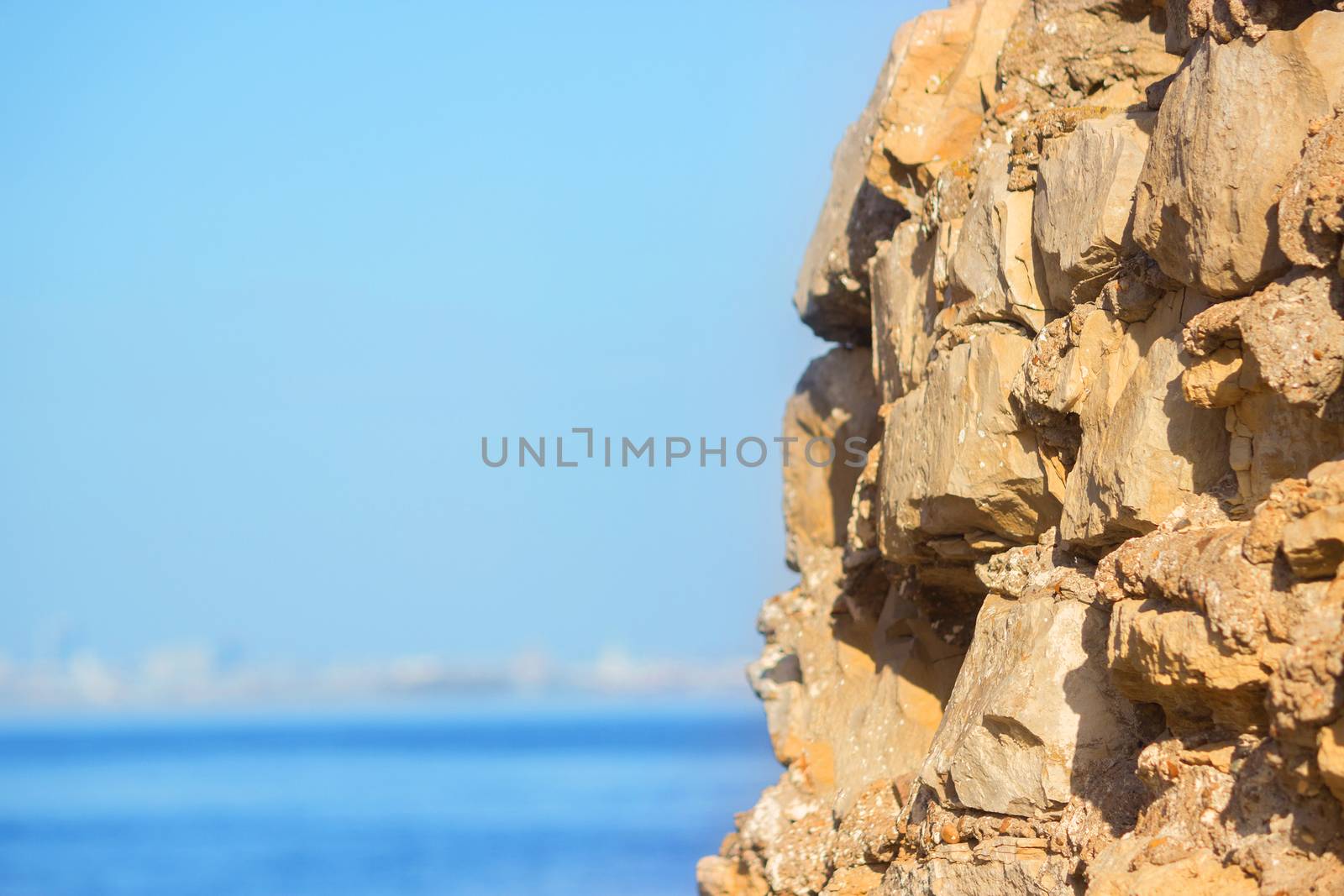 view in Greece. white stones and blue sea