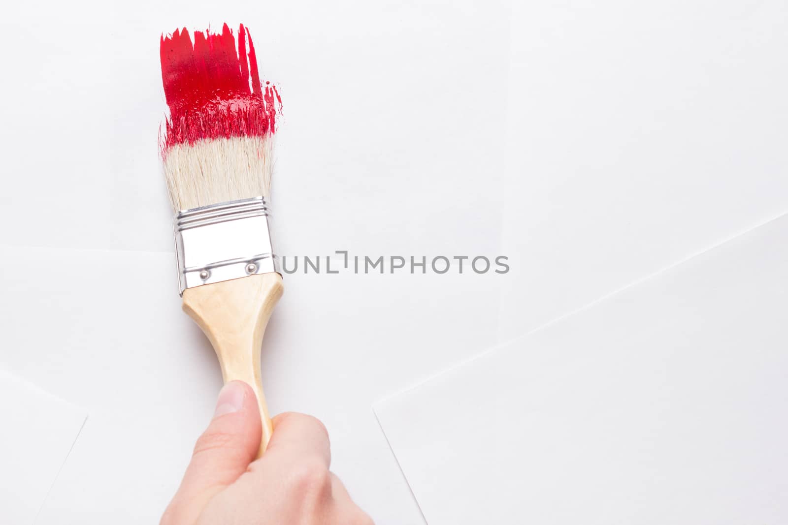 construction brush in hand on white background. not isolated. copy space