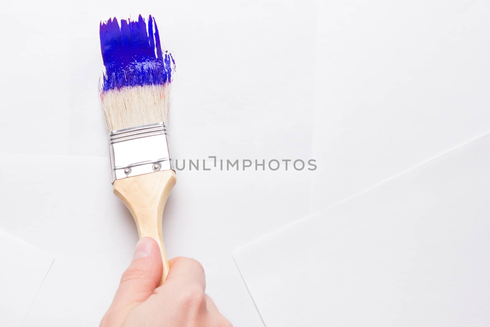 construction brush in hand on white background. not isolated by liwei12