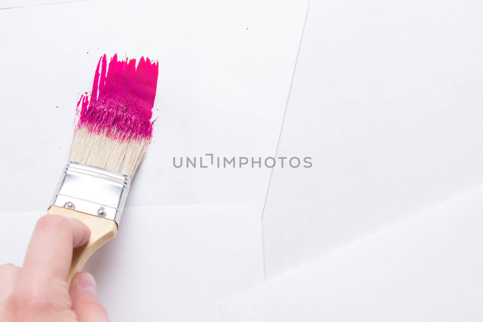 construction brush in hand on white background. not isolated by liwei12