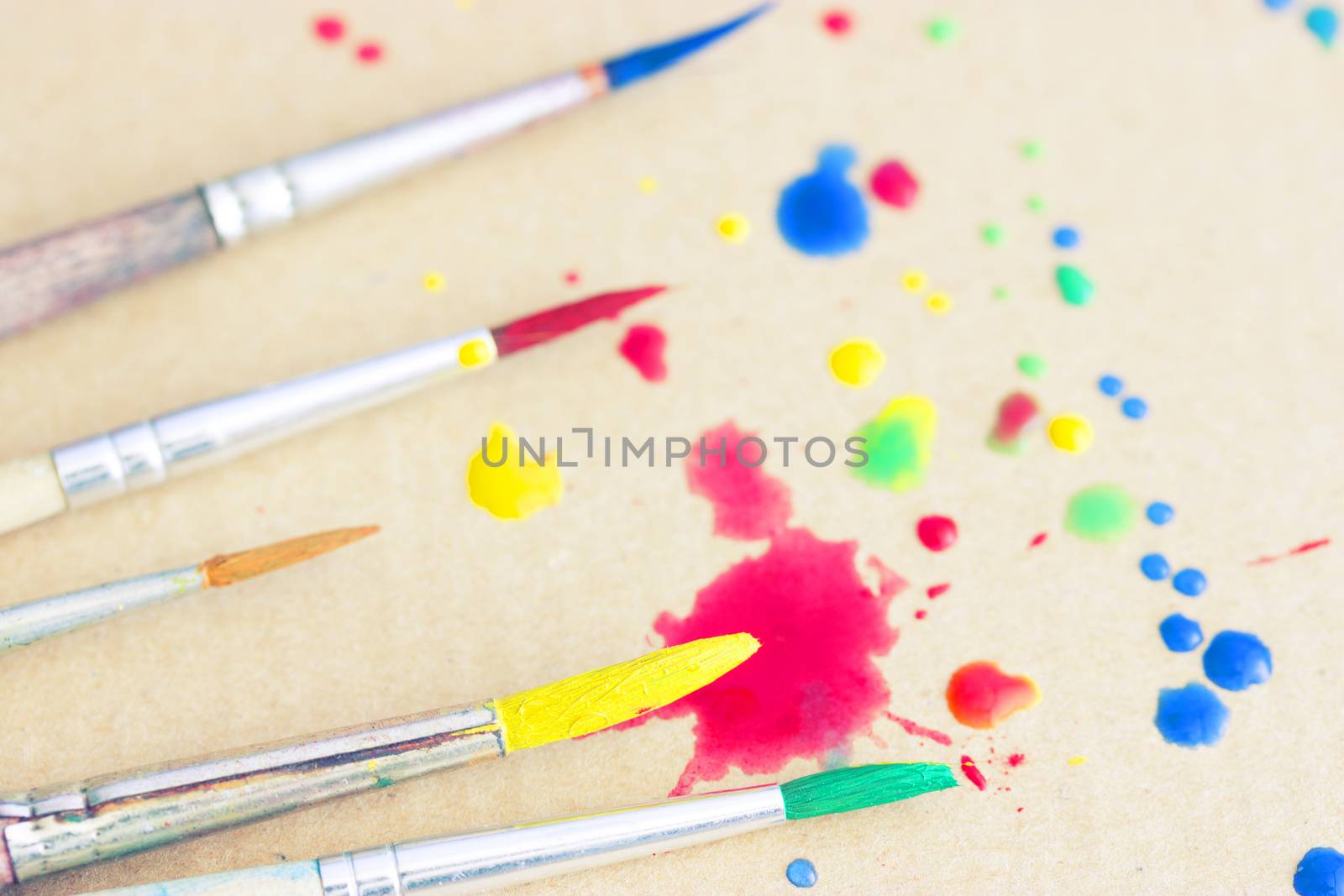 Row of artist paintbrushes closeup by liwei12