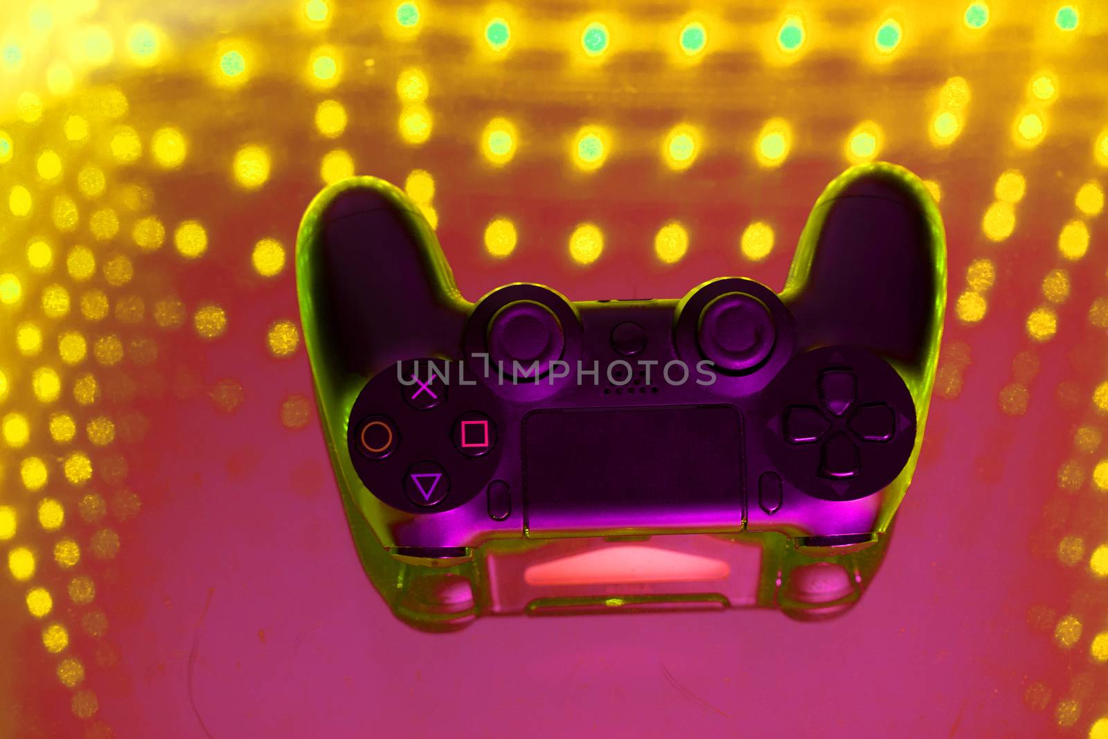 sony play station on illuminated table. game console