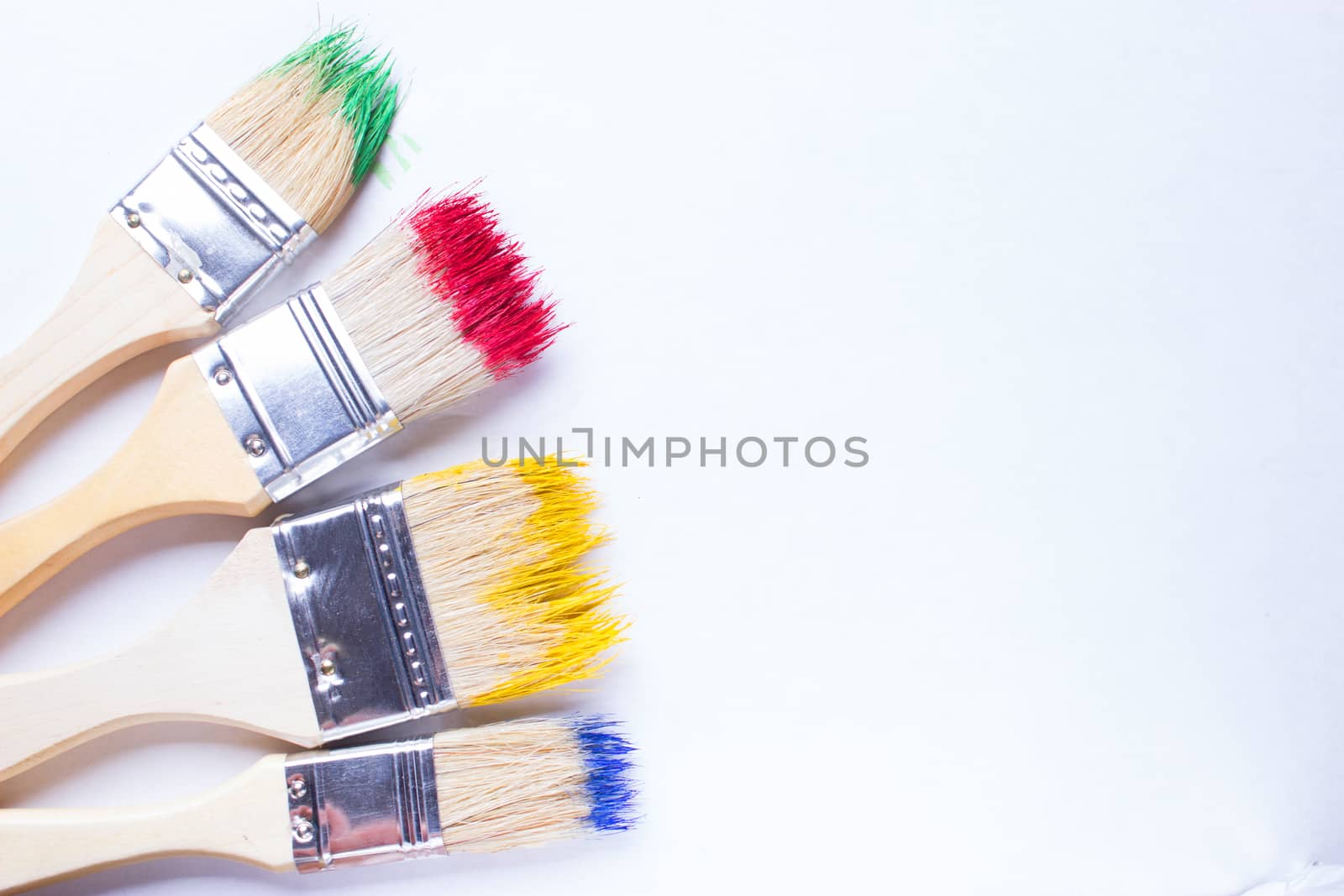 paintbrushes in colorful paint by liwei12
