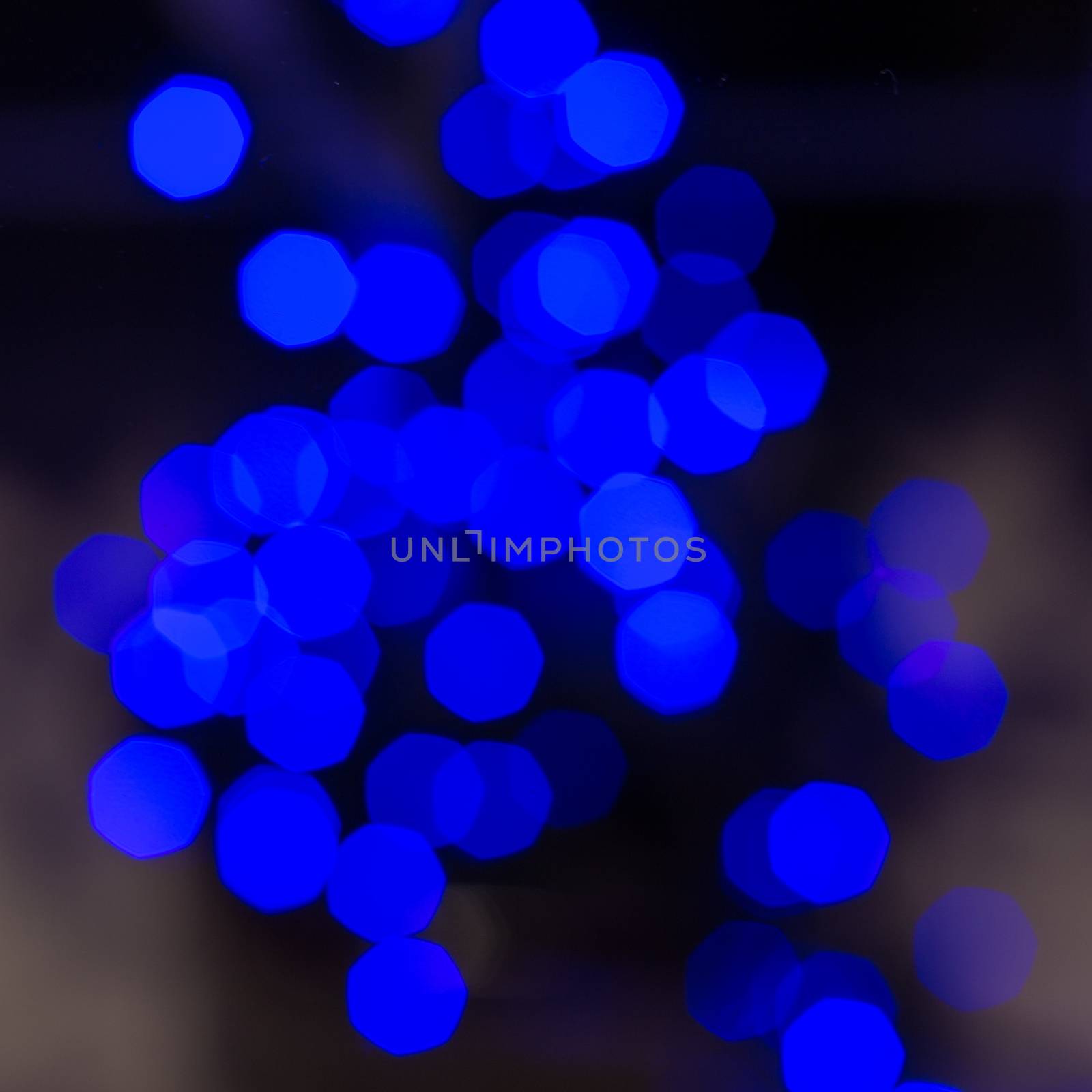 Lights blue blurred lights on black background. Square shape