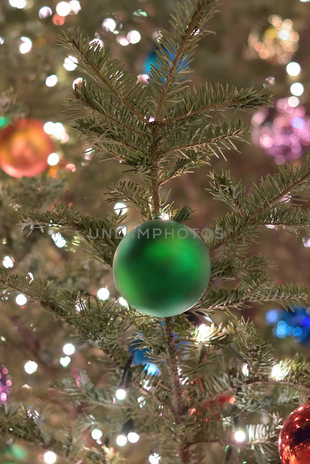 Christmas tree holiday background with decorations in vertical frame