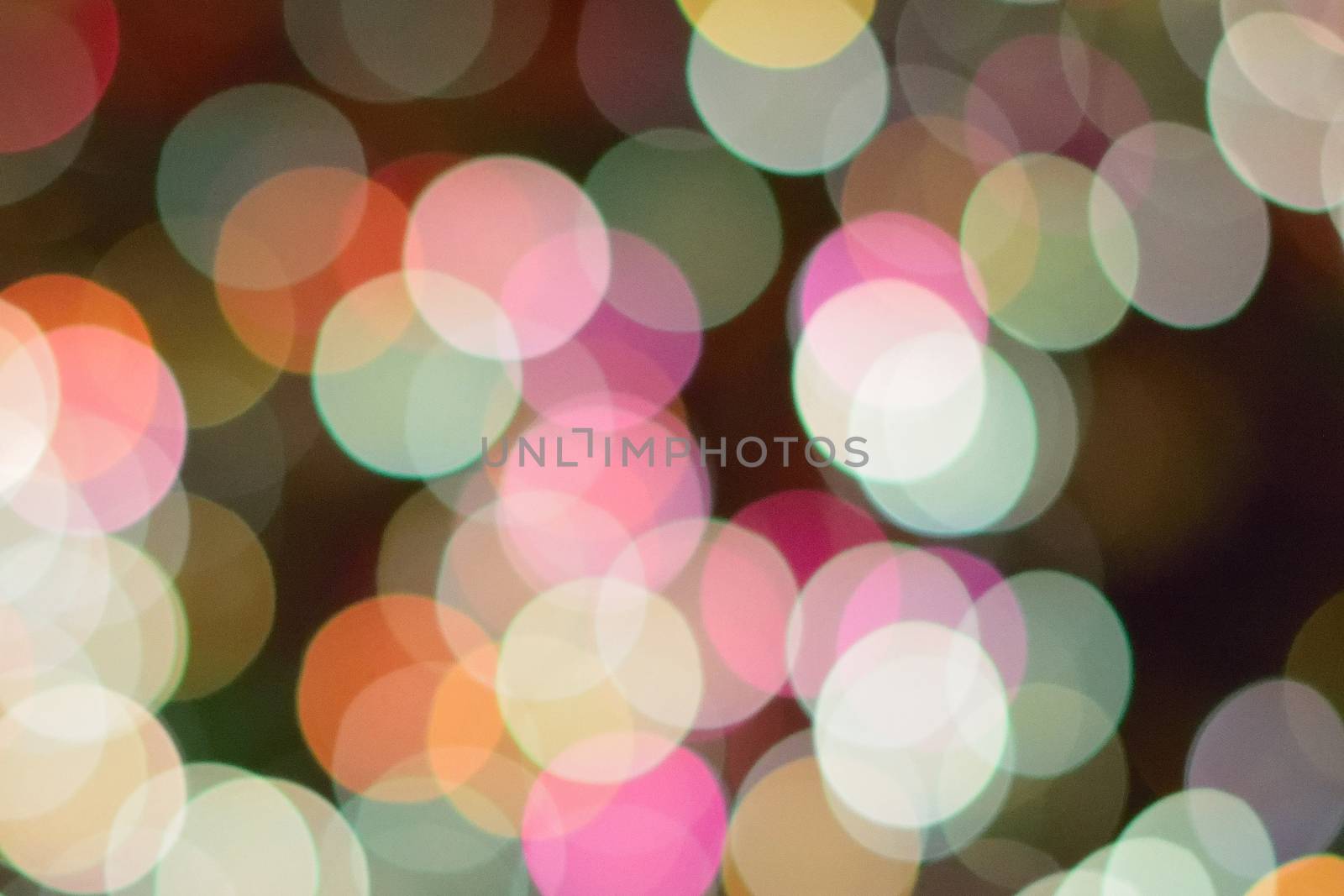 Abstract texture of colorful Christmas lights background blurs in horizontal frame