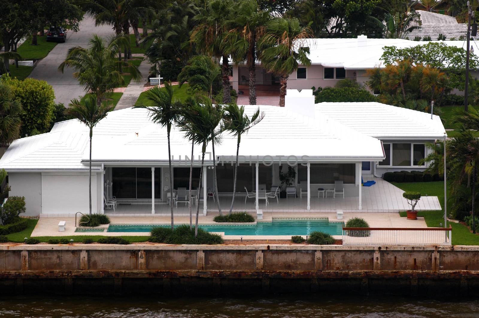 High angle view on house with palms and pool