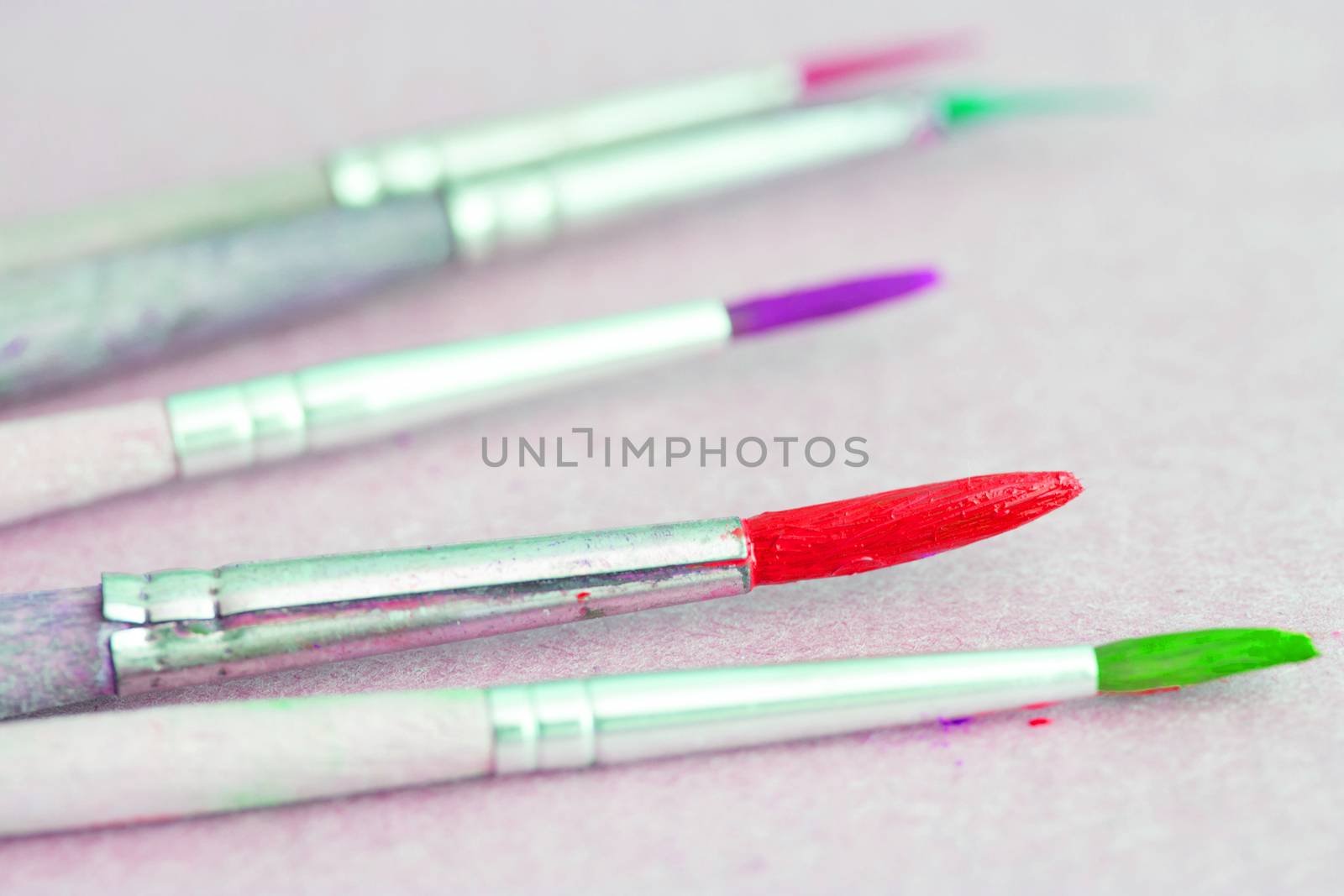 Row of artist paintbrushes closeup by liwei12