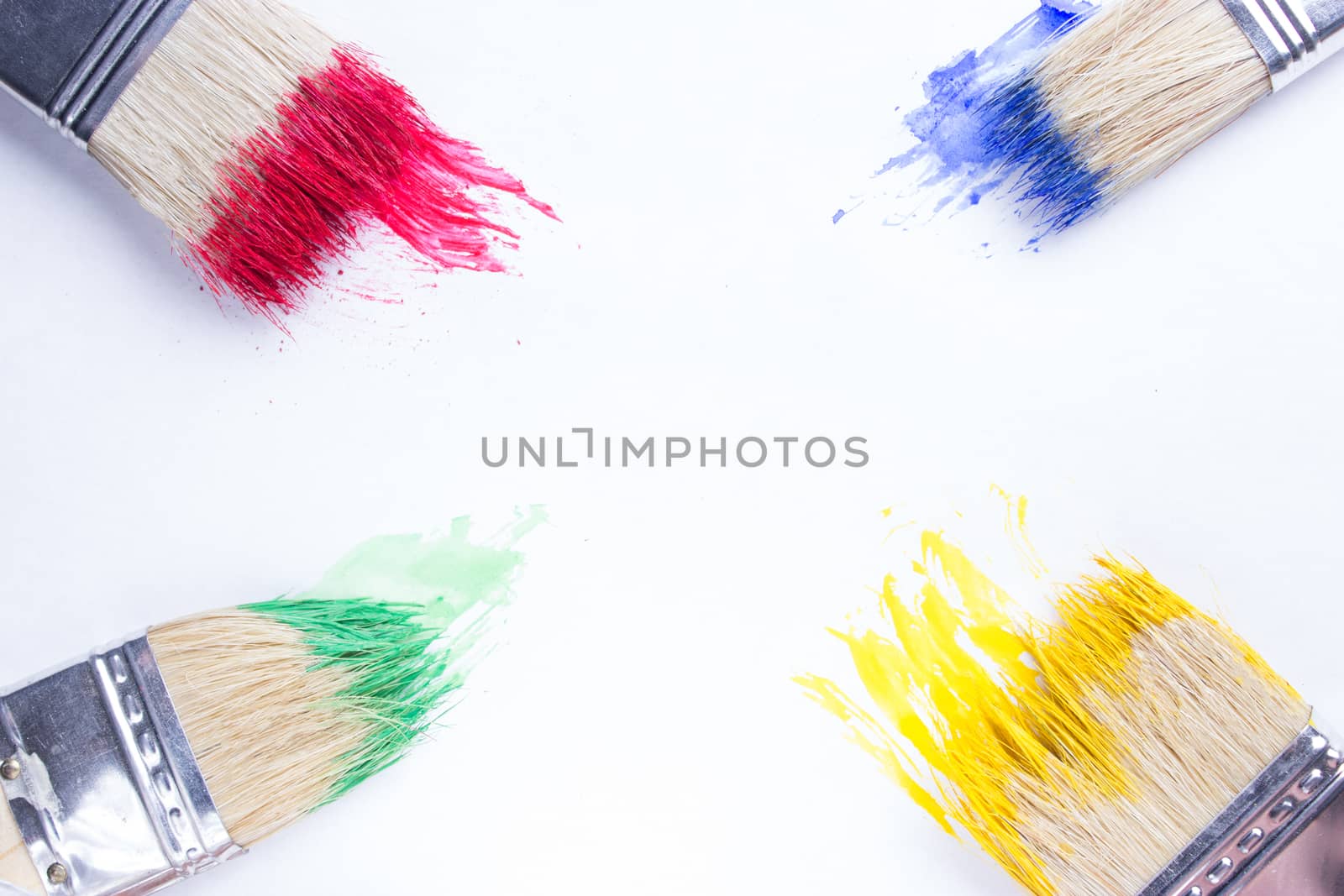 paintbrushes in colorful paint by liwei12