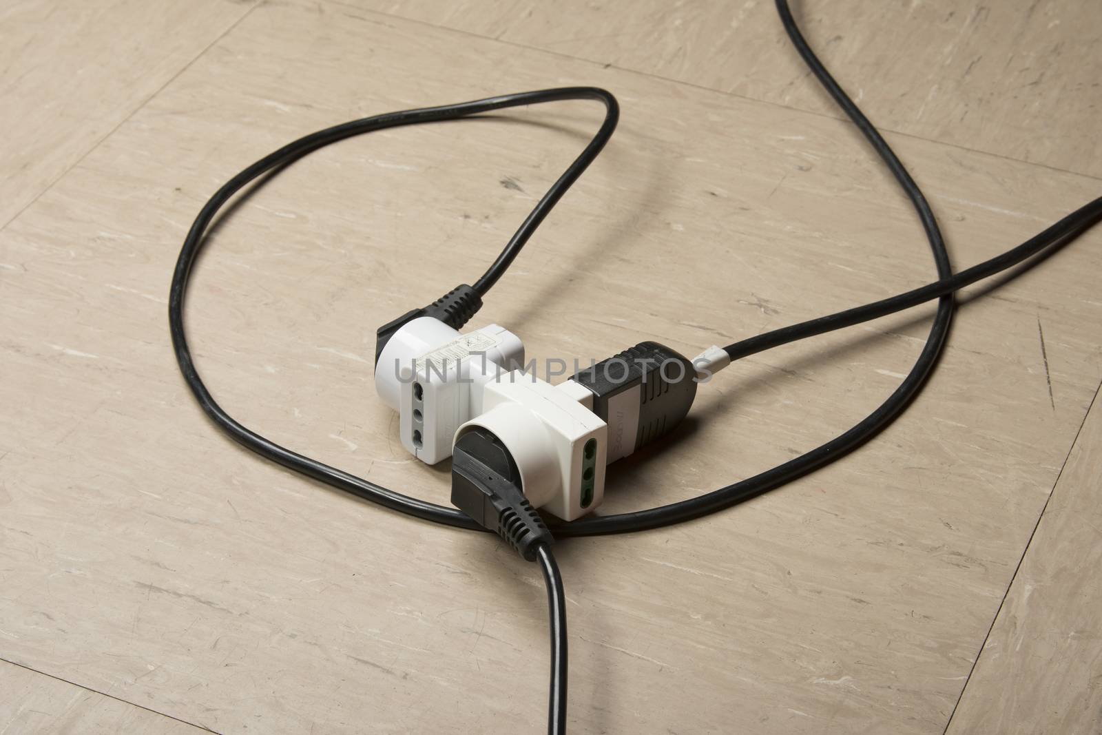 electric cables and multiple sockets on the floor