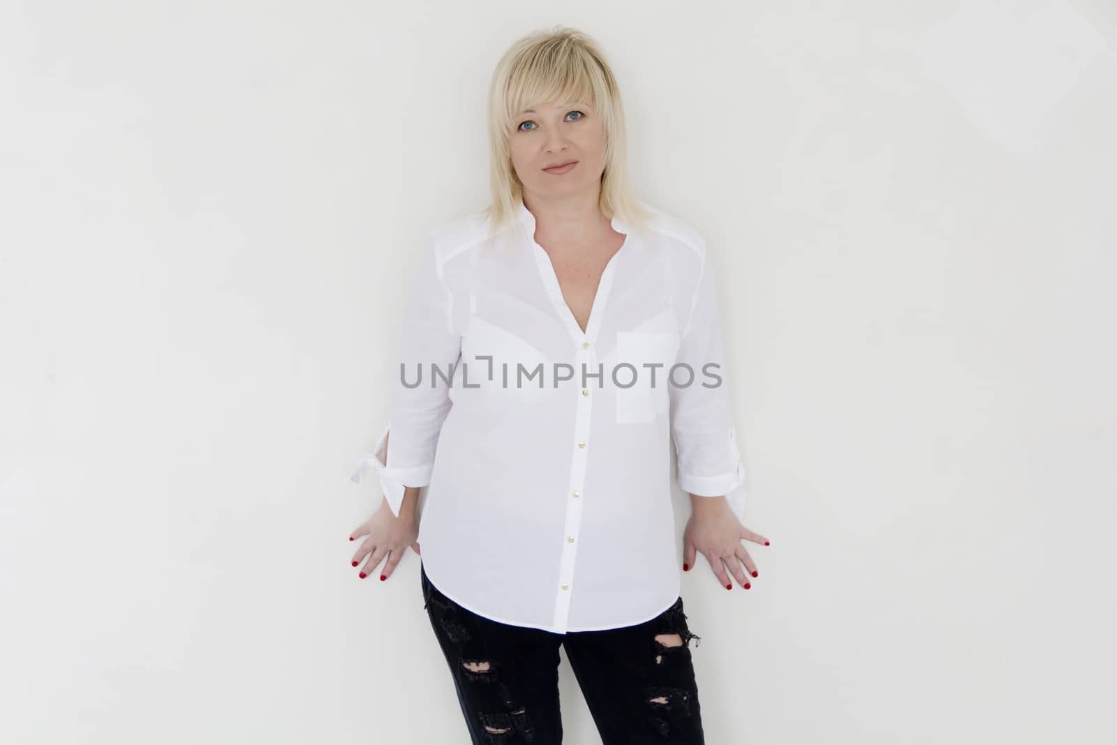 Woman in white stand inside empty room by Julialine