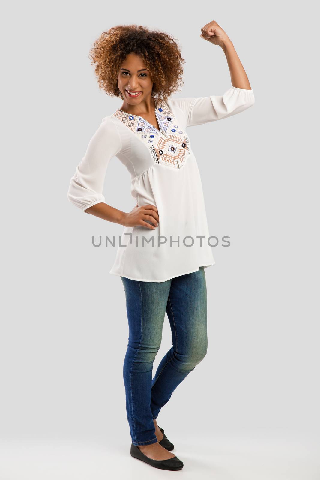 Beautiful and confident African American woman showing her arm 
