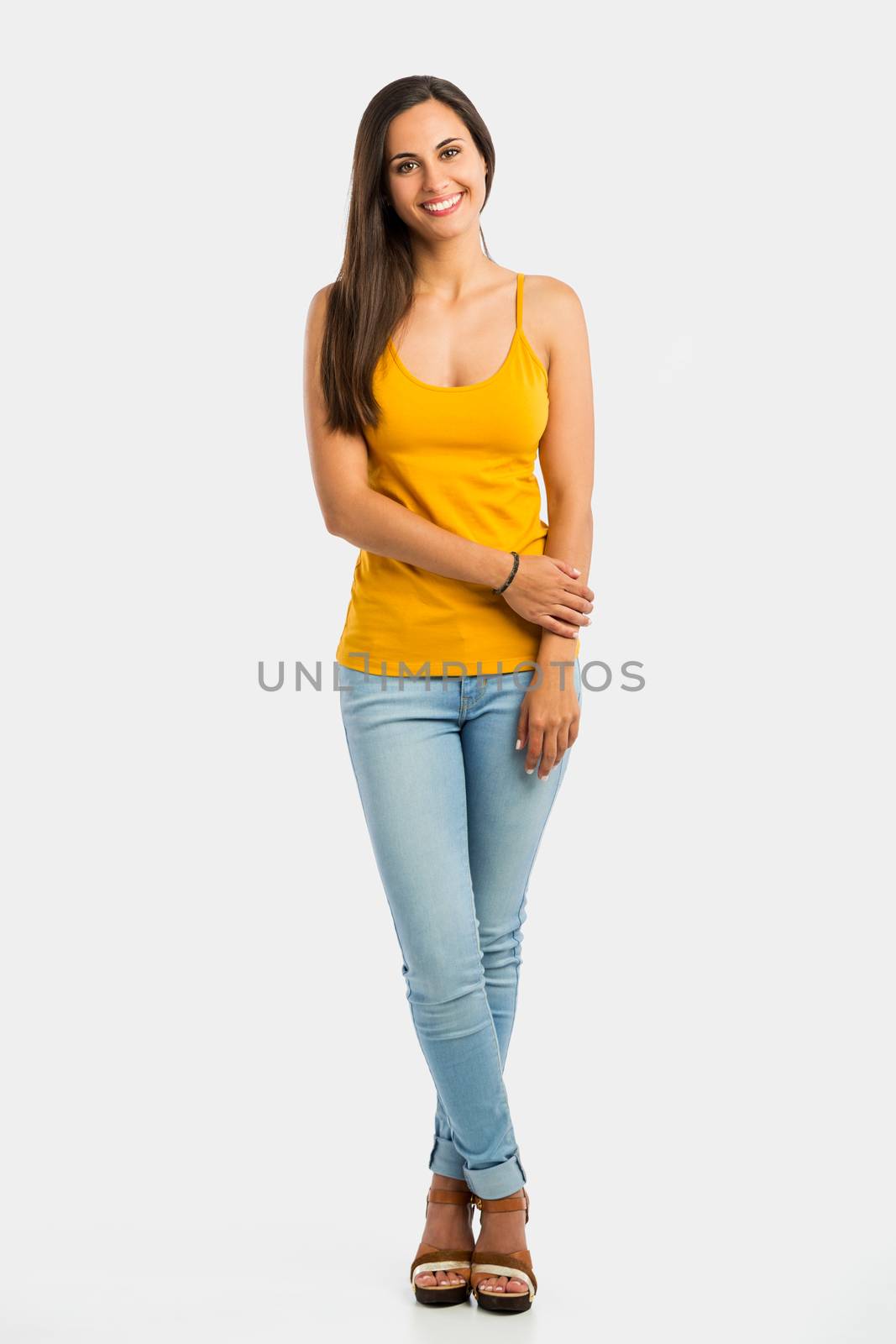 Full length portrait of a beautiful young woman smiling