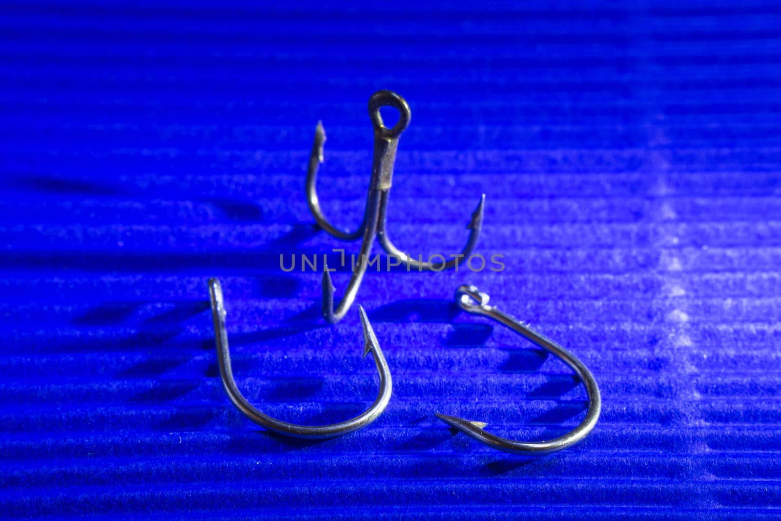 fishing hook over blue background by darksoul72