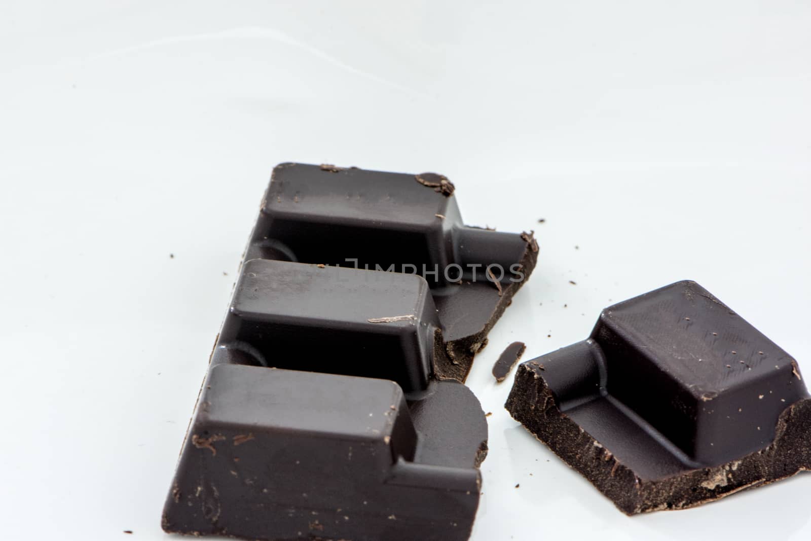 broken slice of the healthy black chocolate