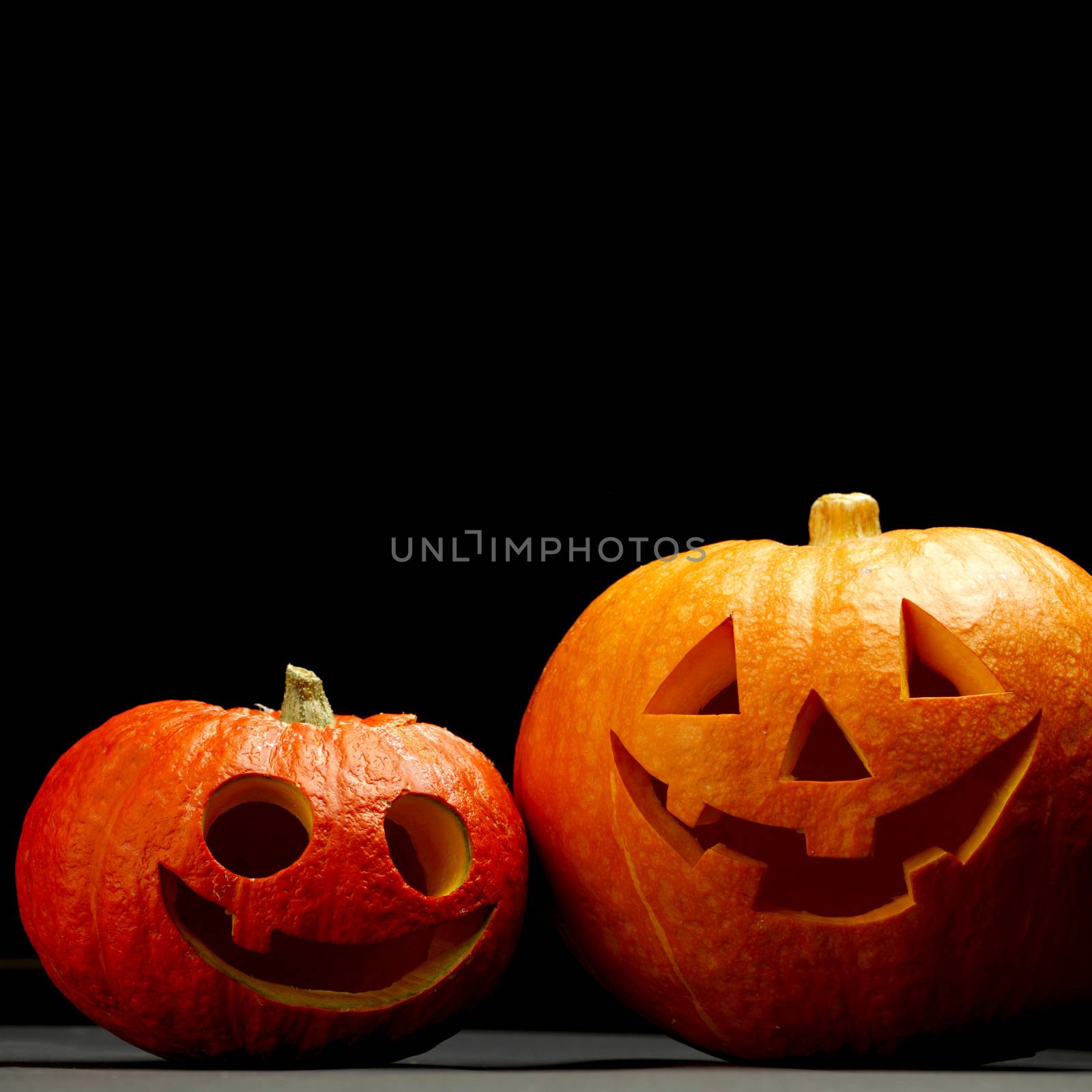 Funny halloween pumpkins isolated on black background