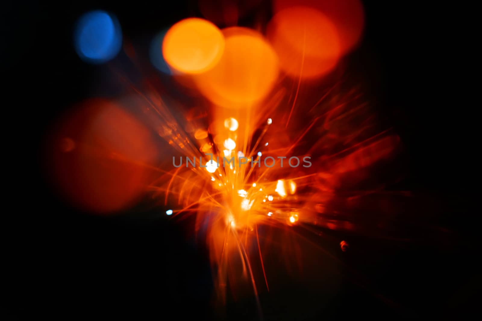 Colorful light explosion on black background. Futuristic wallpaper