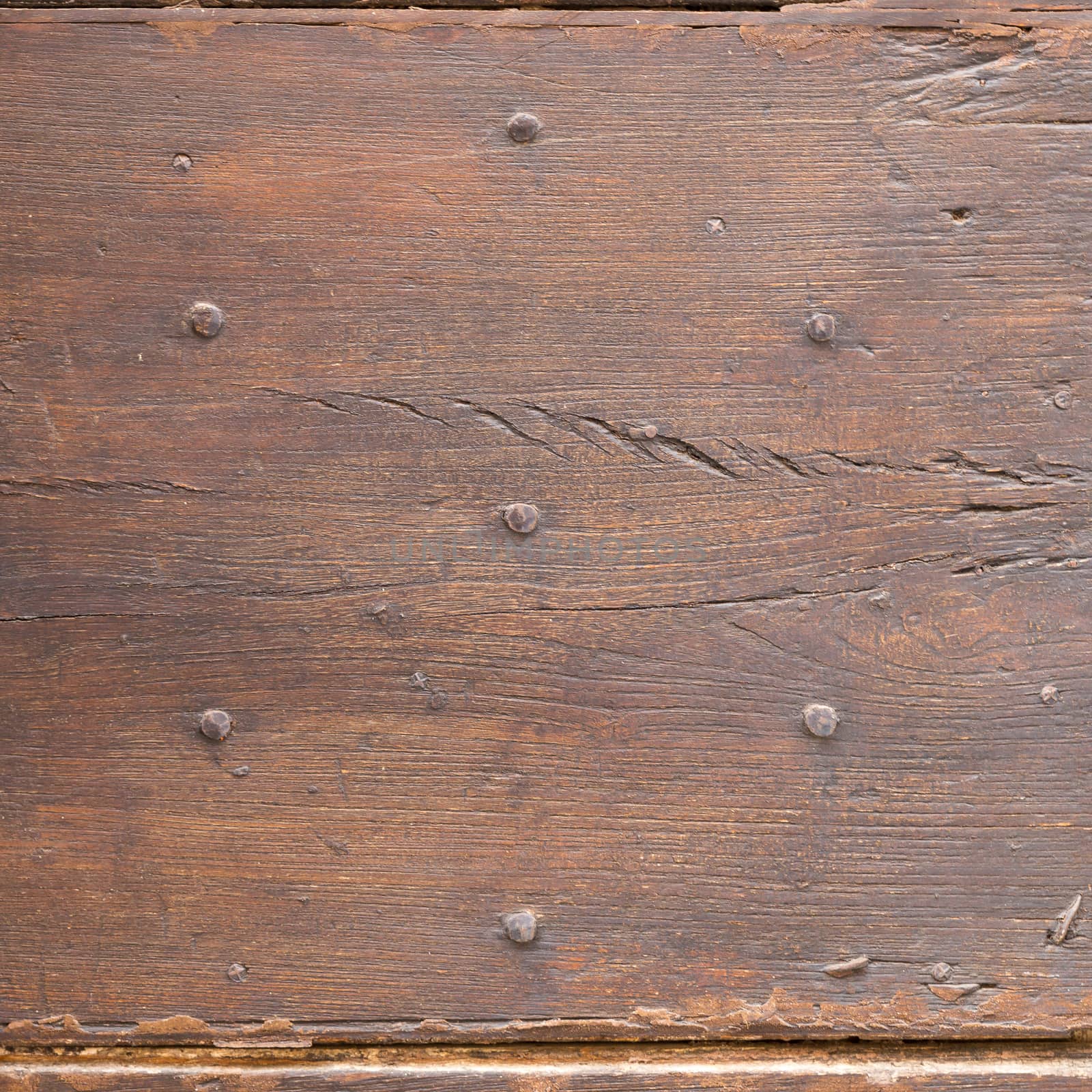 Close up of rustic old door in Spoleto, Italy.