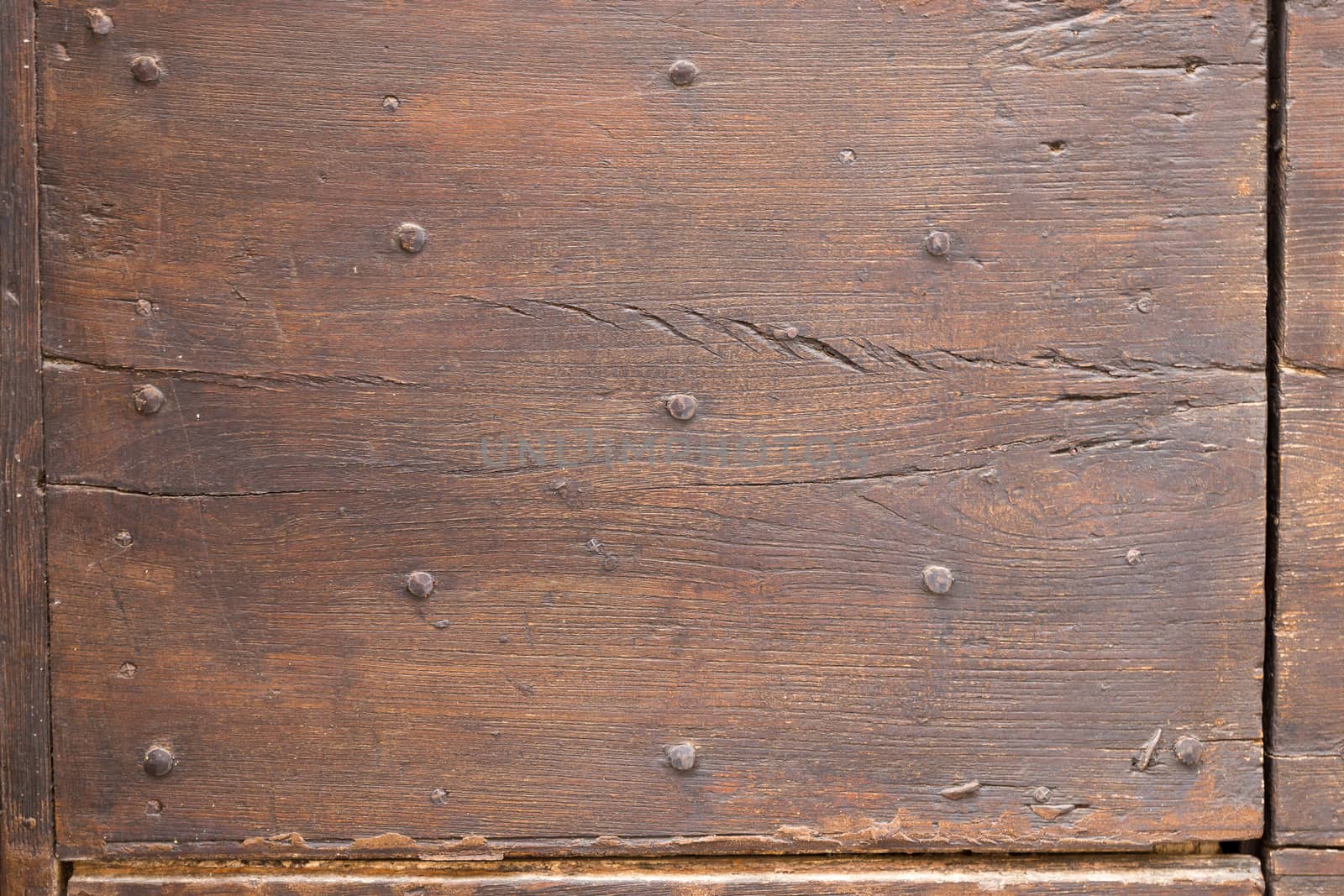 Close up of rustic old door in Spoleto, Italy.