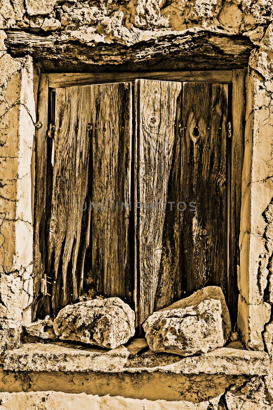 Old wodden window shutter of traditional house in the village Chamaitoulo, Crete, Greece.