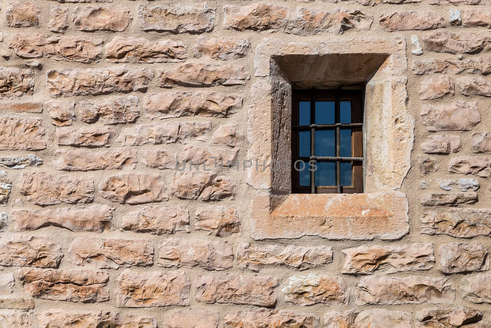 Assisi (Italy): Window on medieval stone wall