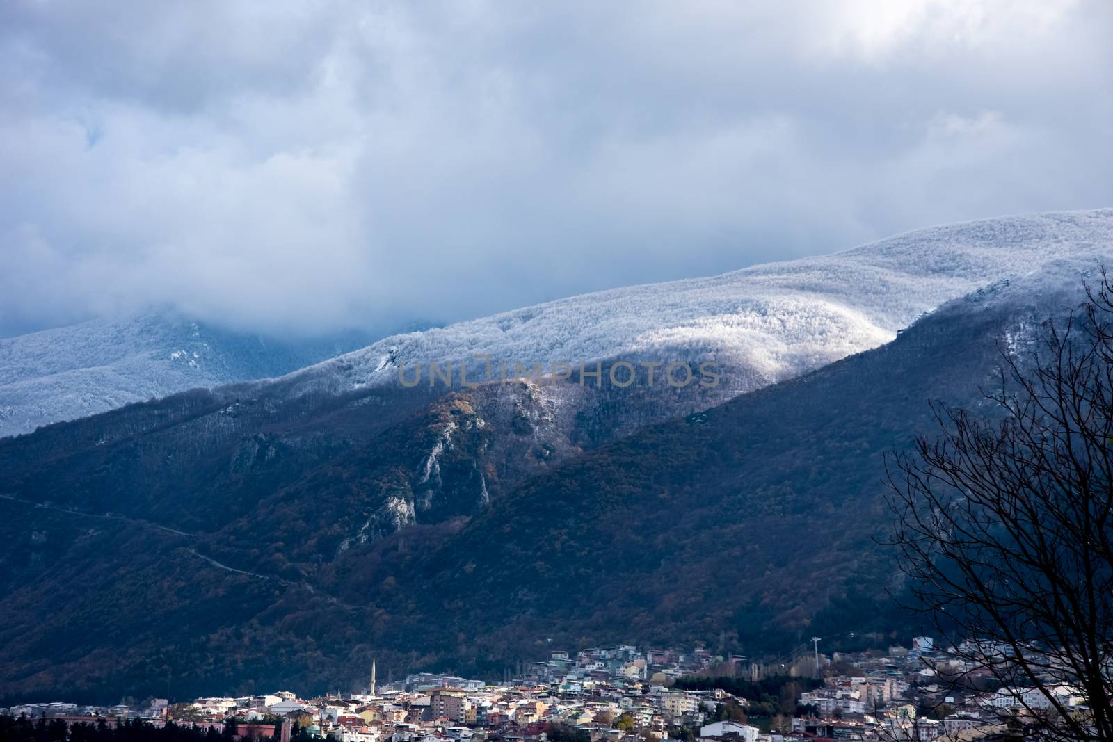 View to the mountain Uludag covered in the snow with city of Bursa benethe it