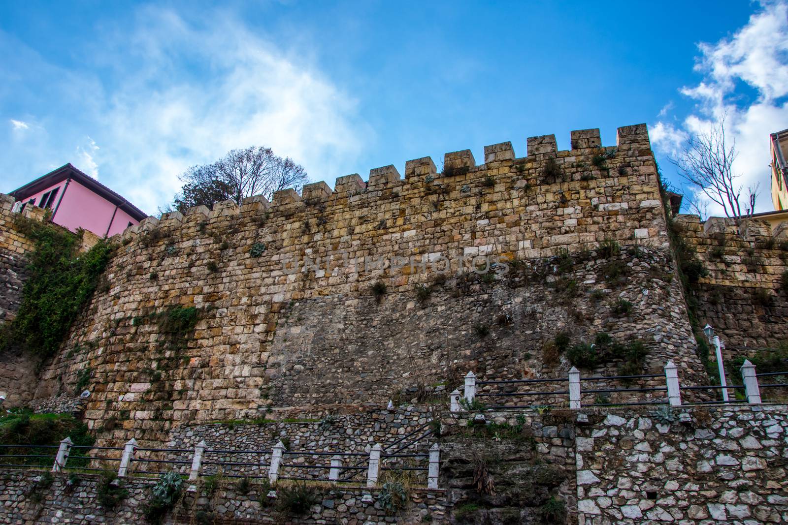 old wall of the castlle from ottoman period near the roud in city of Bursa Turkey