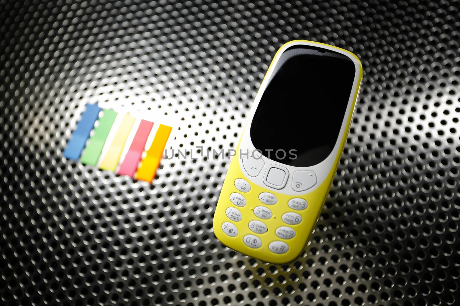 Yellow phone on metal surface by DmitrySteshenko
