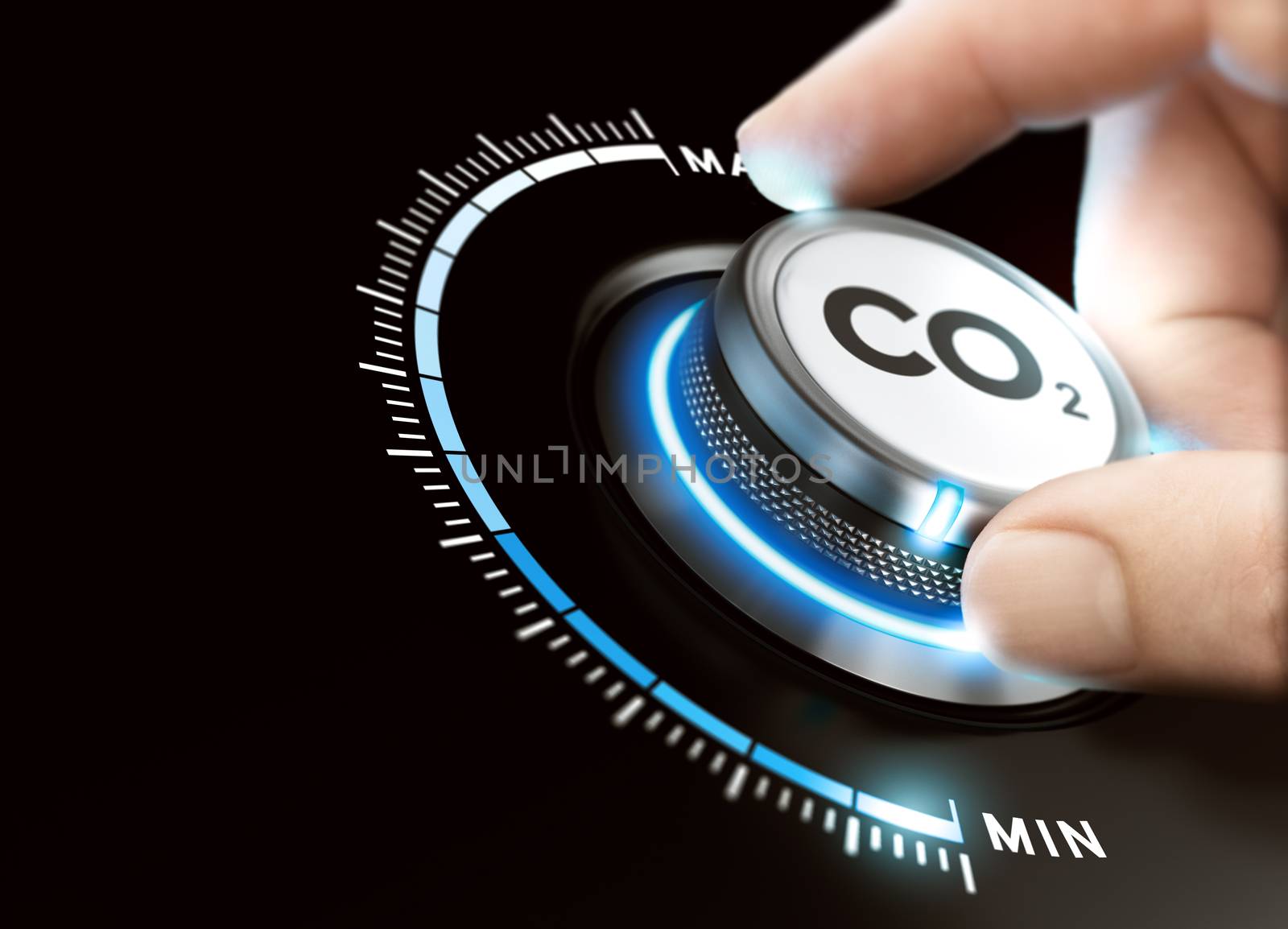 Man turning a carbon dioxyde knob to reduce emissions. CO2 reduction or removal concept. Composite image between a hand photography and a 3D background.